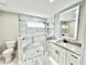 Modern bathroom with walk-in shower, granite countertop, and tile floors at 6425 Sw 180Th Cir, Dunnellon, FL 34432