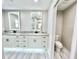 Bathroom boasts double vanity, granite, and separate toilet area at 6425 Sw 180Th Cir, Dunnellon, FL 34432