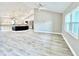 Spacious living room with high ceilings and wood-look flooring at 6425 Sw 180Th Cir, Dunnellon, FL 34432