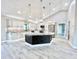 Modern kitchen with a large island, stainless steel appliances, and ample cabinetry at 6425 Sw 180Th Cir, Dunnellon, FL 34432