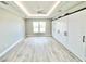 Light-filled bedroom featuring wood-look floors and large closet at 6425 Sw 180Th Cir, Dunnellon, FL 34432