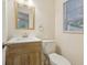 Updated bathroom with wood vanity and window at 4105 S Nashville Ave, Orlando, FL 32839