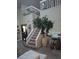 Stairs leading to an upper loft area, with large potted plants at 2909 Clubview # 2909, Orlando, FL 32822