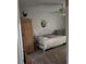 Cozy guest bedroom with a daybed, wardrobe, and ceiling fan at 2909 Clubview # 2909, Orlando, FL 32822
