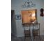 Kitchen features a breakfast bar with two stools and a view into dining area at 2909 Clubview # 2909, Orlando, FL 32822