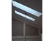 Two skylights illuminating a loft area with a hanging light fixture at 2909 Clubview # 2909, Orlando, FL 32822