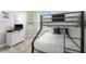 Bedroom with bunk bed, dresser, and TV at 8105 Coconut Palm Way # 203, Kissimmee, FL 34747