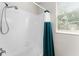 Bathroom featuring a bathtub and teal shower curtain at 8105 Coconut Palm Way # 203, Kissimmee, FL 34747
