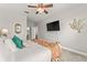 Main bedroom with king bed, TV, and relaxing atmosphere at 8105 Coconut Palm Way # 203, Kissimmee, FL 34747