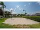 Outdoor sand volleyball court with nets and lights at 8105 Coconut Palm Way # 203, Kissimmee, FL 34747