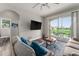 Living room with comfortable seating, large TV, and sliding doors to balcony at 8105 Coconut Palm Way # 203, Kissimmee, FL 34747