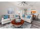 Bright living room with comfy sofas, wood coffee table, and dining area at 8105 Coconut Palm Way # 203, Kissimmee, FL 34747