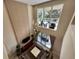 Two-story living room with large windows and modern chandelier at 3219 Brasilia Ave, Kissimmee, FL 34747
