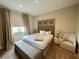 Comfortable main bedroom with a king-size bed and sitting area at 3219 Brasilia Ave, Kissimmee, FL 34747