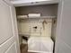 White shelving and hanging space in guest closet at 3219 Brasilia Ave, Kissimmee, FL 34747