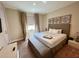 King-size bed, neutral decor, and ample natural light at 3219 Brasilia Ave, Kissimmee, FL 34747