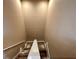 Modern carpeted staircase with neutral colored walls at 3219 Brasilia Ave, Kissimmee, FL 34747