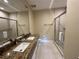 Elegant bathroom with double vanity and a large walk-in shower at 3219 Brasilia Ave, Kissimmee, FL 34747
