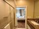 Bathroom with shower and view into bedroom at 3219 Brasilia Ave, Kissimmee, FL 34747