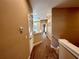Hallway with carpeted flooring and access to bedrooms at 3219 Brasilia Ave, Kissimmee, FL 34747