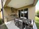 Outdoor patio with built-in grill, dining table, and seating area at 3219 Brasilia Ave, Kissimmee, FL 34747