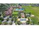 Clubhouse, pool, and tennis courts in a community at 290 Silver Maple Rd, Groveland, FL 34736