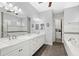 Elegant bathroom with double vanity, soaking tub, and walk-in shower at 290 Silver Maple Rd, Groveland, FL 34736