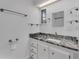 Bathroom with granite countertop and modern vanity at 411 Palo Verde Dr, Leesburg, FL 34748