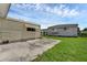 Spacious backyard with two mobile homes and a large paved patio at 411 Palo Verde Dr, Leesburg, FL 34748