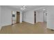 Bedroom with mirrored closet and wood-look floors at 411 Palo Verde Dr, Leesburg, FL 34748
