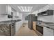 Modern kitchen featuring granite countertops and stainless steel appliances at 411 Palo Verde Dr, Leesburg, FL 34748
