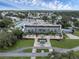 Aerial view of a community center with ample parking and landscaping at 411 Palo Verde Dr, Leesburg, FL 34748