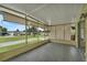 Spacious screened porch with view of neighborhood at 411 Palo Verde Dr, Leesburg, FL 34748