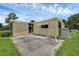Mobile home with a screened porch and a paved patio at 411 Palo Verde Dr, Leesburg, FL 34748