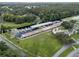 Aerial view of a community marina with covered boat slips at 411 Palo Verde Dr, Leesburg, FL 34748