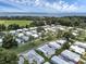 Aerial view of a 55+ community near the lake, showcasing the landscape at 411 Palo Verde Dr, Leesburg, FL 34748