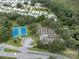 Aerial view of tennis courts and community garden at 411 Palo Verde Dr, Leesburg, FL 34748