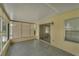 Empty screened porch with sliding glass doors at 411 Palo Verde Dr, Leesburg, FL 34748