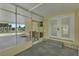 Screened porch entrance with access to the home and carport at 411 Palo Verde Dr, Leesburg, FL 34748