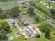 Aerial view of community building with spacious parking lot at 411 Palo Verde Dr, Leesburg, FL 34748