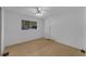 Spacious bedroom with light walls and wood-look flooring at 411 Palo Verde Dr, Leesburg, FL 34748