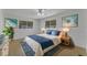 Main bedroom with a comfortable bed and blue accents at 411 Palo Verde Dr, Leesburg, FL 34748