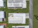 An aerial close-up view of a single home in a 55+ community at 411 Palo Verde Dr, Leesburg, FL 34748