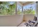 Private balcony with chairs and view of trees at 11886 Nautica Dr, Orlando, FL 32827