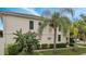 Inviting exterior with lush landscaping and palm trees at 11886 Nautica Dr, Orlando, FL 32827