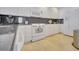 White kitchen with granite countertops and stainless steel appliances at 11886 Nautica Dr, Orlando, FL 32827