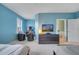 Spacious bedroom with two twin beds, a TV, and plenty of natural light at 11886 Nautica Dr, Orlando, FL 32827