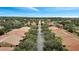 Community road with houses and trees on both sides at 11886 Nautica Dr, Orlando, FL 32827