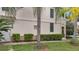 Tan house with green shutters and manicured hedges at 11886 Nautica Dr, Orlando, FL 32827