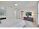 Spacious bedroom with a queen bed, TV, and access to the bathroom at 11886 Nautica Dr, Orlando, FL 32827
